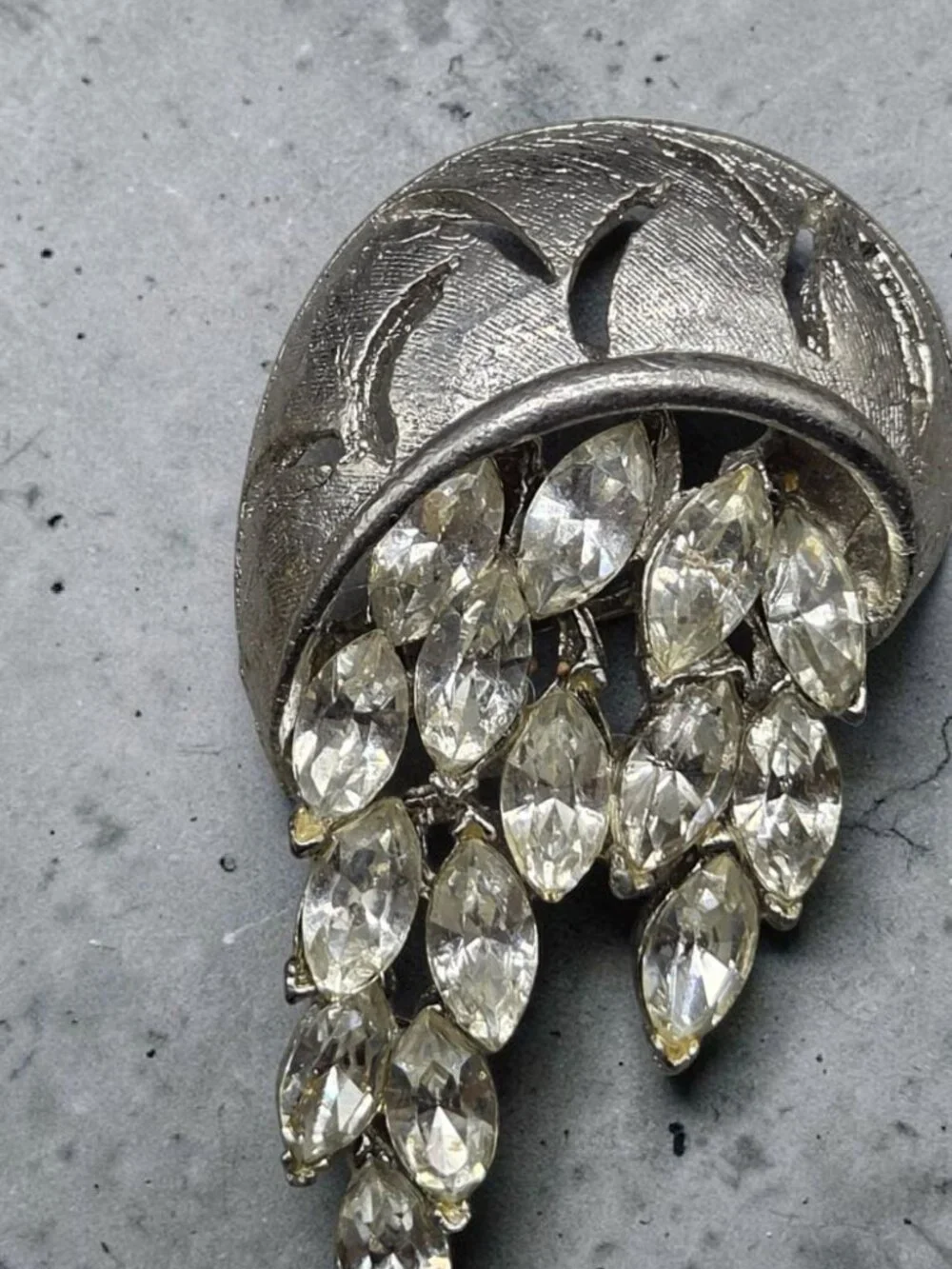 None this brooch